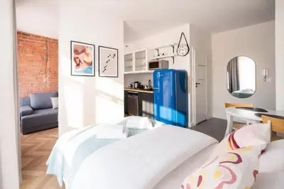 Łóżko lub łóżka w pokoju w obiekcie BK studio - cozy and modern close to National Stadium