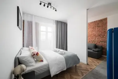 Łóżko lub łóżka w pokoju w obiekcie BK studio - cozy and modern close to National Stadium