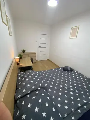 Łóżko lub łóżka w pokoju w obiekcie Rooms in Warsaw - G39