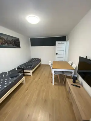 Łóżko lub łóżka w pokoju w obiekcie Rooms in Warsaw - G39