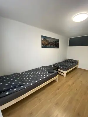 Łóżko lub łóżka w pokoju w obiekcie Rooms in Warsaw - G39