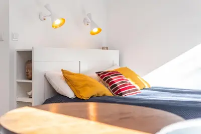 Łóżko lub łóżka w pokoju w obiekcie aleja Wyzwolenia 14A by Homeprime