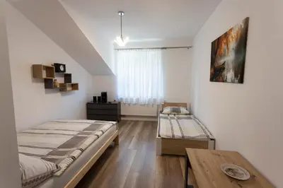 Łóżko lub łóżka w pokoju w obiekcie U Wojtka