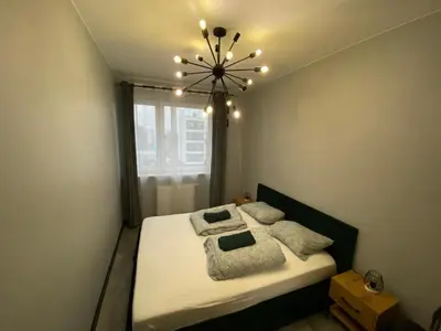 Łóżko lub łóżka w pokoju w obiekcie Warsaw near Airport Apartment Modern, Stylish