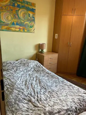 Łóżko lub łóżka w pokoju w obiekcie Pokoje Warszawa Ursynów