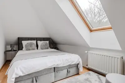 Łóżko lub łóżka w pokoju w obiekcie Lumina luxury house in Warsaw