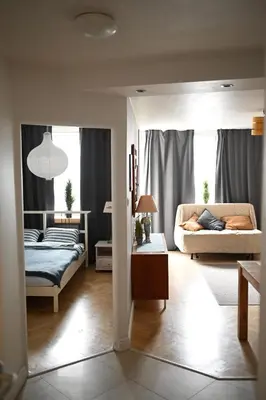Łóżko lub łóżka w pokoju w obiekcie Apartments pry metro Świętokrzyska