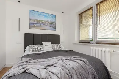 Łóżko lub łóżka w pokoju w obiekcie Warsaw City Life Apartment Bagno by Noclegi Renters
