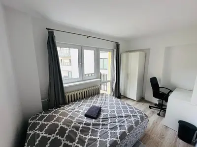 Łóżko lub łóżka w pokoju w obiekcie Wola Ratusz Rooms
