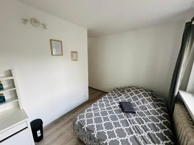 Łóżko lub łóżka w pokoju w obiekcie Wola Ratusz Rooms