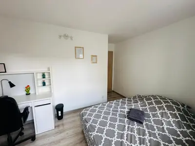 Łóżko lub łóżka w pokoju w obiekcie Wola Ratusz Rooms