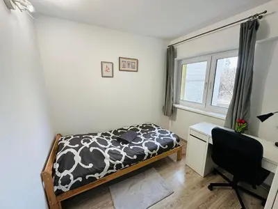 Łóżko lub łóżka w pokoju w obiekcie Wola Ratusz Rooms