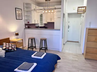 Łóżko lub łóżka w pokoju w obiekcie OhMyHome-Ogrodowa