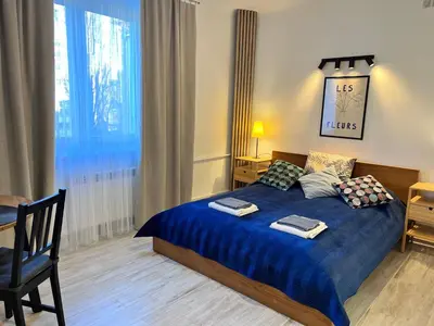 Łóżko lub łóżka w pokoju w obiekcie OhMyHome-Ogrodowa