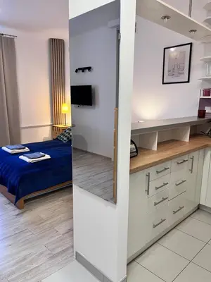 Łóżko lub łóżka w pokoju w obiekcie OhMyHome-Ogrodowa
