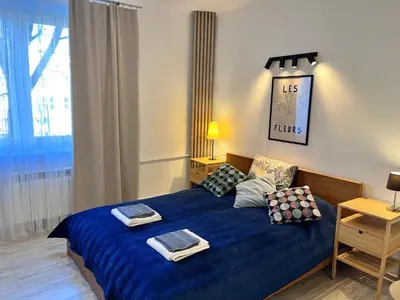 Łóżko lub łóżka w pokoju w obiekcie OhMyHome-Ogrodowa