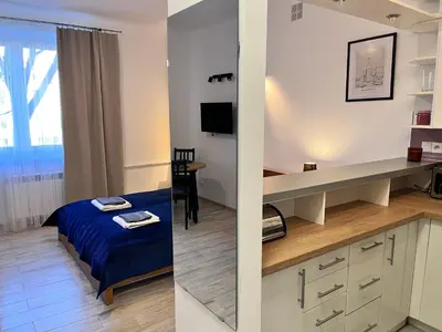 Łóżko lub łóżka w pokoju w obiekcie OhMyHome-Ogrodowa