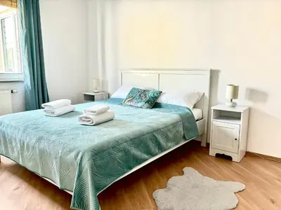 Łóżko lub łóżka w pokoju w obiekcie Real Life Apartament