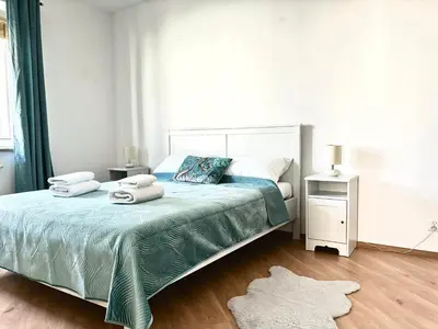 Łóżko lub łóżka w pokoju w obiekcie Real Life Apartament