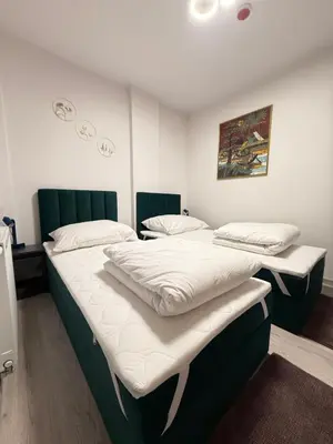 Łóżko lub łóżka w pokoju w obiekcie Warsaw Smart Apartment with Parking