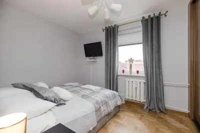 Łóżko lub łóżka w pokoju w obiekcie ShortStayPoland Bohaterewicza B174