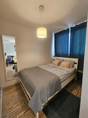 Łóżko lub łóżka w pokoju w obiekcie Apartament Centrum Rondo ONZ