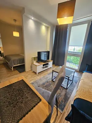 Łóżko lub łóżka w pokoju w obiekcie Apartament Centrum Rondo ONZ