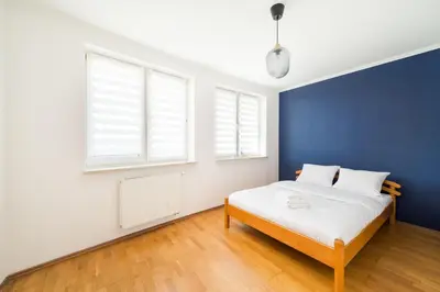 Łóżko lub łóżka w pokoju w obiekcie Bemowo Narwik Malachite Apartment by BookingHost