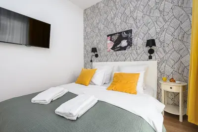 Łóżko lub łóżka w pokoju w obiekcie Wola Cozy Apartment by P&O Apartments