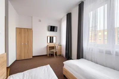 Łóżko lub łóżka w pokoju w obiekcie Patra