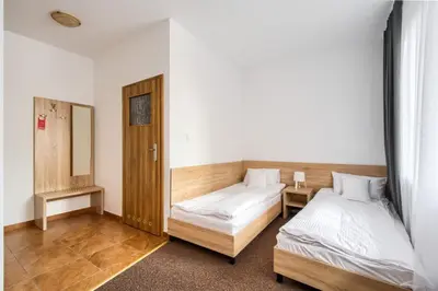 Łóżko lub łóżka w pokoju w obiekcie Patra
