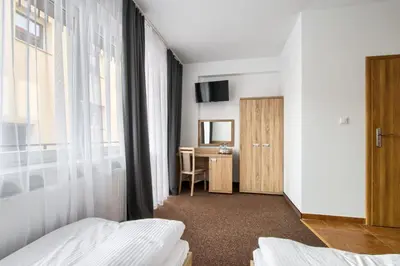 Łóżko lub łóżka w pokoju w obiekcie Patra