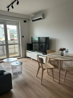 Telewizja i/lub zestaw kina domowego w obiekcie Sunray Apartament