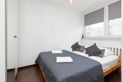 Łóżko lub łóżka w pokoju w obiekcie Apartments Warsaw Grzybowska by Noclegi Renters