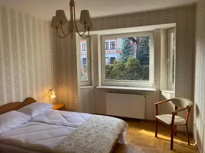 Łóżko lub łóżka w pokoju w obiekcie Apartament u Basi przy Centrum Zdrowia Dziecka
