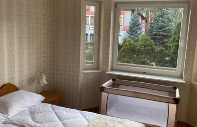 Łóżko lub łóżka w pokoju w obiekcie Apartament u Basi przy Centrum Zdrowia Dziecka