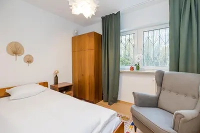 Łóżko lub łóżka w pokoju w obiekcie ShortStayPoland Piekałkiewicza B112