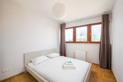 Łóżko lub łóżka w pokoju w obiekcie Wronia Business Superior Residence by BookingHost