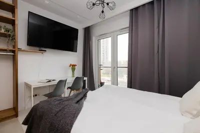 Łóżko lub łóżka w pokoju w obiekcie ShortStayPoland Kasprzaka Apartments