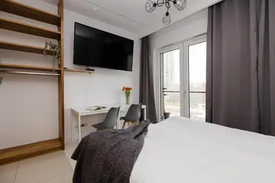 Łóżko lub łóżka w pokoju w obiekcie ShortStayPoland Kasprzaka Apartments