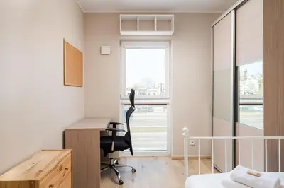 Łóżko lub łóżka w pokoju w obiekcie Bemowo Lazurowa Comfort Apartment by BookingHost