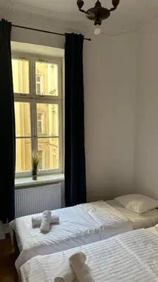 Łóżko lub łóżka w pokoju w obiekcie Kamienica Śródmieście Apartament 18A