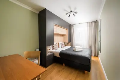 Łóżko lub łóżka w pokoju w obiekcie Powiśle Charming Apartment by BookingHost