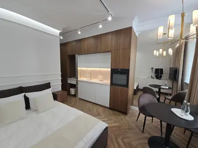 Łóżko lub łóżka w pokoju w obiekcie IXIA Central Warsaw Apartments