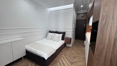 Łóżko lub łóżka w pokoju w obiekcie IXIA Central Warsaw Apartments