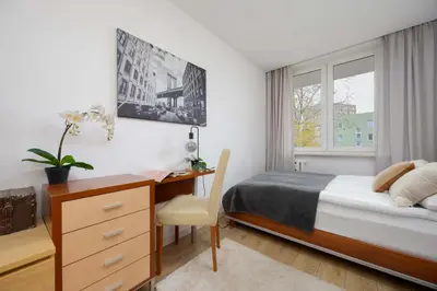 Łóżko lub łóżka w pokoju w obiekcie Suwalska Comfort Family Apartament with Balcony Warsaw by Noclegi Renters