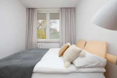 Łóżko lub łóżka w pokoju w obiekcie Suwalska Comfort Family Apartament with Balcony Warsaw by Noclegi Renters