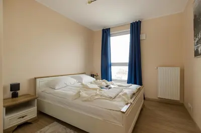 Łóżko lub łóżka w pokoju w obiekcie ShortStayPoland Toruńska B177