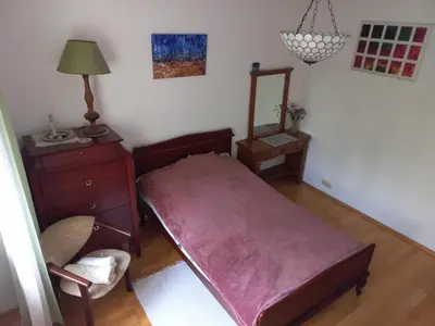 Łóżko lub łóżka w pokoju w obiekcie Cichy i przyjemny pokój na Muranowie
