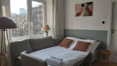 Łóżko lub łóżka w pokoju w obiekcie Olive Garden City Center